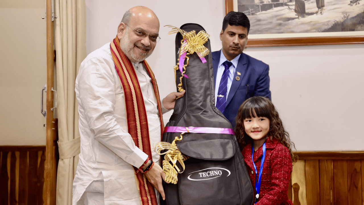 Amit Shah gifts guitar to Mizoram’s 7-year-old singing sensation